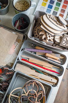 Top view of tools, brushes and materials in an artist's workshop