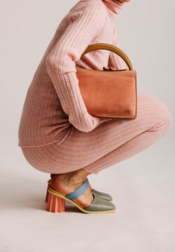 Close-Up of Stylish Bag and Vibrant High-Heeled Shoes with Pink 