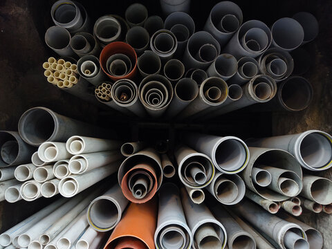 Pipes of different sizes stacked in a shop