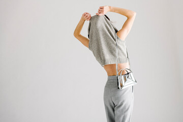 Minimalist Fashion Scene Featuring Casual Knitted Top and Stylis