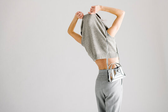 Minimalist Fashion Scene Featuring Casual Knitted Top and Stylis
