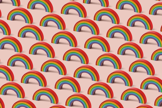 Seamless rainbow toy pattern on pink background