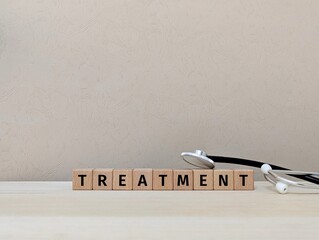 Treatment concept with wooden blocks and stethoscope, medical. 