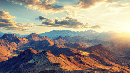 Desert mountain range with dramatic shadows at sunset.