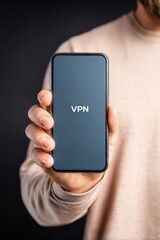anonymous browsing cybersecurity concept. Holding a smartphone displaying VPN application screen.