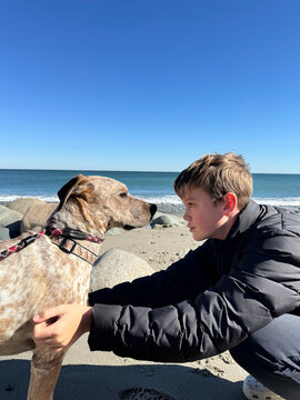 Boy looking eye to eye at his dog Portrait 