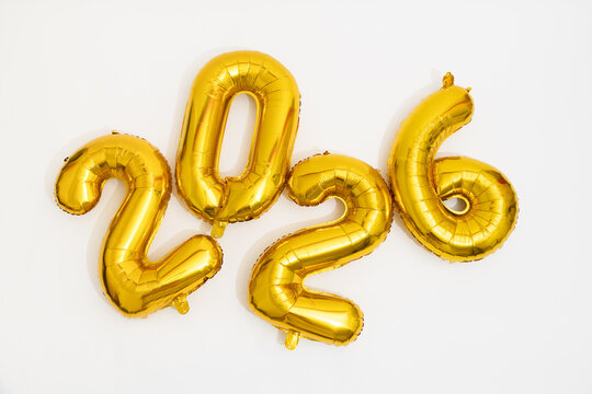 Celebration With Golden Balloons and Confetti for New Year 2026