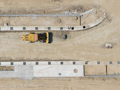 Aerial View of New Town Construction Site with Bulldozer
