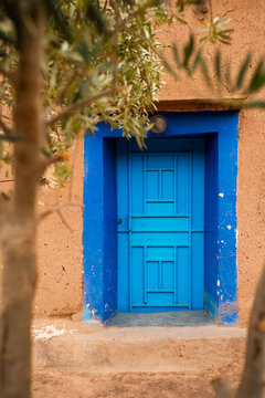 Colorful door on an adobe house