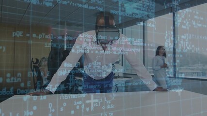 Man placing hands on table activating VR code grid detecting malware while colleague observing - Powered by Adobe