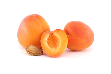 Fresh Whole and Half Apricots on a White Background