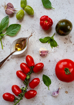 Tomatoes, basil, olive oil. Mediterranean summer foods.