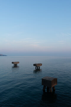 Statuesque Conrcrete Elements at Sunrise in Lake Erie
