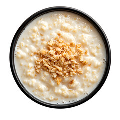 A delicious looking gelatina de horchata on a dark bowl isolated on a white background