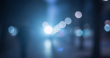 Abstract blurred lights form a delicate bokeh effect in serene blue and crisp white tones, evoking a cool and calming visual atmosphere.