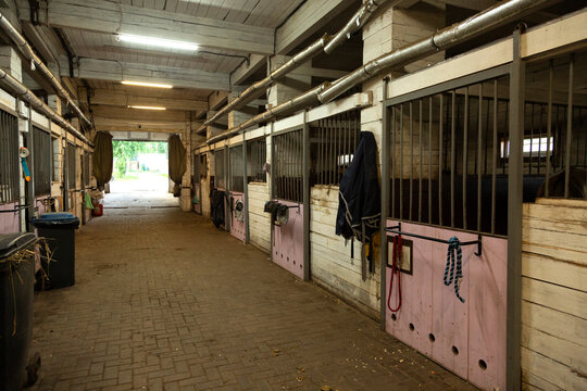 Empty horse stable boxes waiting for horses in a riding club or farm