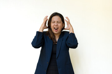Frustrated businesswoman touching head with both hands while working
