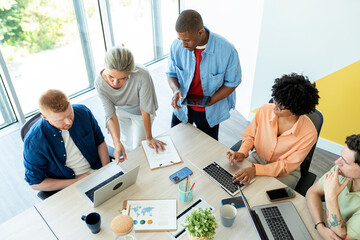 Business people collaborating on project in modern office
