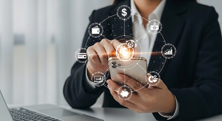 A businesswoman uses a smartphone to access financial applications, managing digital transactions.