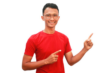 An Asian man wearing a red shirt points upwards with a happy expression.