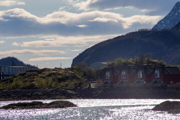 Scenic Lofoten fjords, snowy mountains, green fields and coastal landscapes in spring. Stunning...