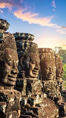 Fototapeta premium Ancient stone faces at sunrise