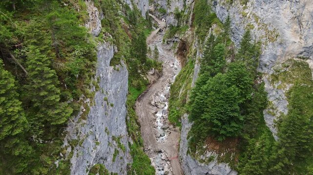 Establishing aerial of Sottoguda gorge reveals wild Italian mountain terrain