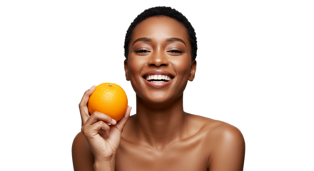 A beautiful young African American woman with a radiant smile proudly holds a fresh, vibrant orange, symbolizing health and natural beauty.