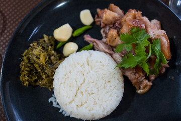 Thai food Khao Kha Moo Jasmine rice with stewed pork leg served on black dish