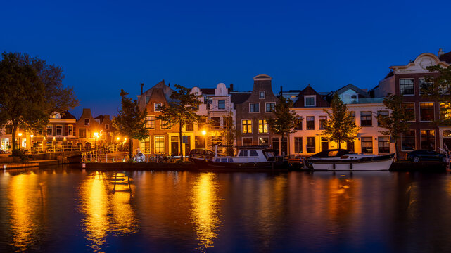Harlem cityscape along river Binnen Spaame in the twilight with colorful lighting in The Netherlands.
