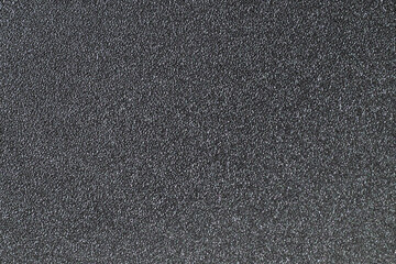 Close up of rough textured black surface background