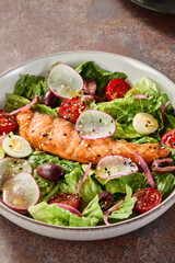Grilled salmon salad with fresh vegetables, bright lighting, overhead composition