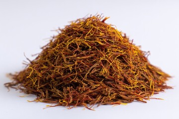 Fototapeta premium Pile of saffron threads on a white background