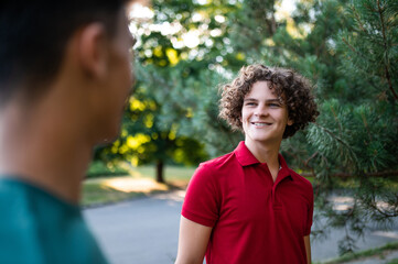 Fototapeta premium Friends spending time together in the park and looking joyful