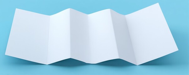 White paper with an accordion fold on a light blue surface creates texture