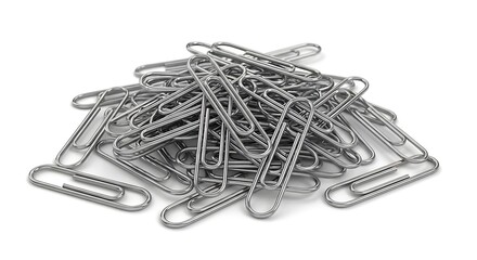 A pile of shiny silver metal paper clips scattered on a white background