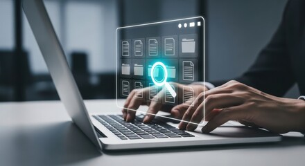Hands typing on laptop with futuristic digital interface