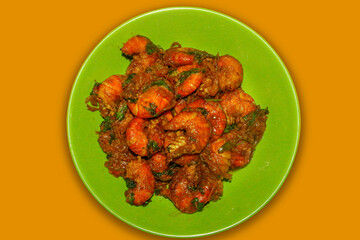 A Delicious and Traditional Bengali and Indian Seafood Dish on a Green Plate, Set Against a Vibrant Yellow Background