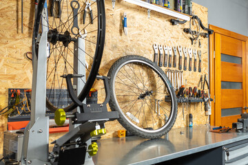 Wall organizer with wrenches, screwdrivers and pliers, bicycle wheel