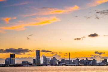 sweet gold sunset winter and light illumination from Cityscape of Yokohama city, Skyline and office building and downtown in  Minatomirai Area, Yokohama city port, Kanagawa, Japan