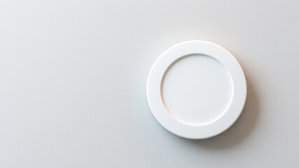 A simple oval shaped white picture frame mounted on a plain grey background with copy space