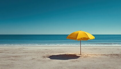 Sunny beach scene with yellow umbrella