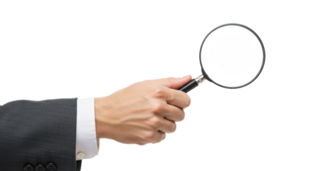 Adult hand, professional cuff, holding classic magnifying glass on clean high-key studio background, copy space. Concept of meticulous analysis