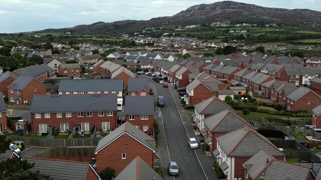 Holyhead homes aerial view over peaceful early morning residential housing and Welsh mountain