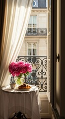 Bright parisian apartment balcony with flowers and sunlight