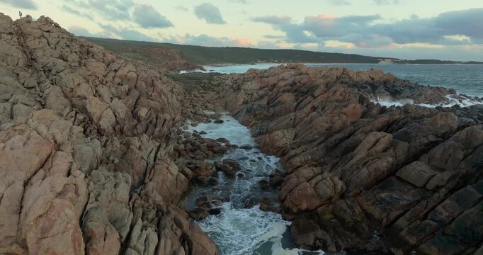4k Aerial views of rugged rocky coastline in South West Australia at sunset