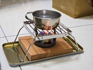 Boiling Water Cup on an Alcohol Stove