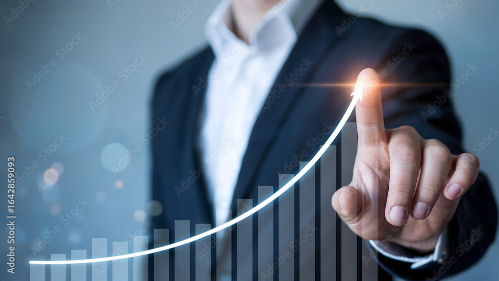 Poster a professional business image showing a man in a suit touching a glowing upward arrow on a digital g