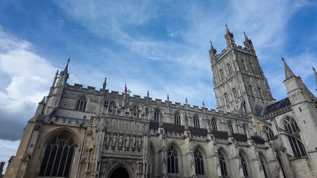 Wide angle timelapse of Gloucester Cathedral side with camera pan in England
