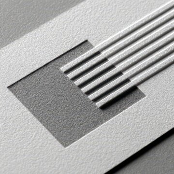 Close-up of a white circuit board with etched lines
